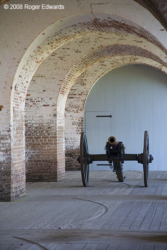 Cannon down hall of arches, Fort Pulaski Nat. Mon.